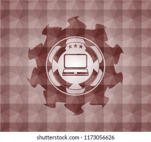 laptop icon inside red seamless geometric emblem.