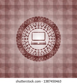 laptop icon inside red seamless emblem or badge with abstract geometric pattern background.