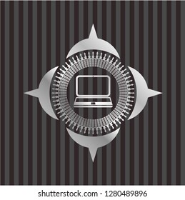 laptop icon inside silver emblem