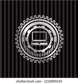 laptop icon inside silvery shiny emblem