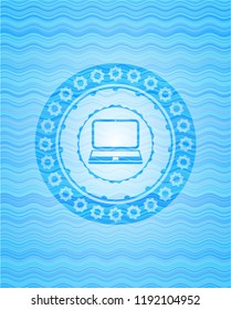 laptop icon inside sky blue water badge.