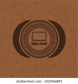 laptop icon inside wooden emblem. Retro