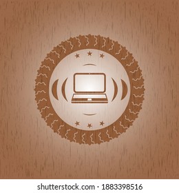 laptop icon inside wooden emblem. 