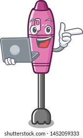 With laptop immersion mascot blender on kitchen table