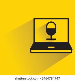 laptop and mic icon with shadow on yellow background