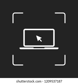 Laptop or notebook with arrow on screen. White object in camera autofocus on dark background