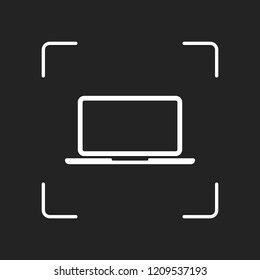 Laptop or notebook computer icon. White object in camera autofocus on dark background