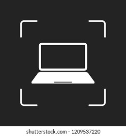 Laptop or notebook computer icon. White object in camera autofocus on dark background