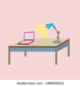 Laptop on the desk with lamp,