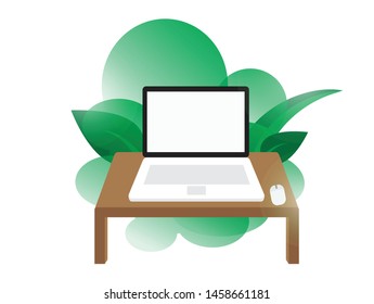 Laptop on table with green leaf as background, concept for relaxation working