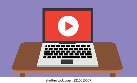 Laptop with play button on screen on desktop