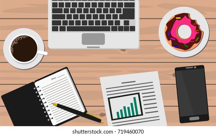 Laptop, smartphone, notebook with pen, coffee, donut, graph chart report on wooden table