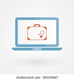 Laptop and suitcase