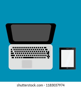 Laptop and tablet on a color background