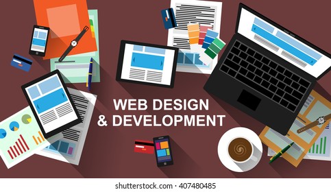 Laptop, tablet and other modern working devices on table. Web design and development concept.