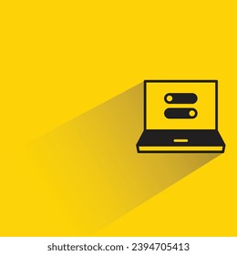 laptop and toggle icon with shadow on yellow background