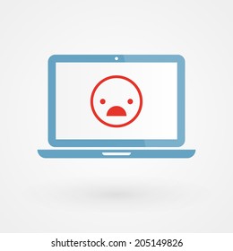 Laptop and unhappy smiley