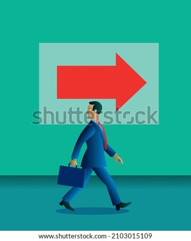 A large arrow sign points right. A businessman is walking that way but his head is turned to look behind. He looks into the past, rather than into the future.