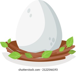A large and beautiful egg of a bird or snake or other animal in a nest with green leaves. Grey color.