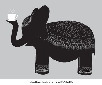 A large beautiful elephant carries the cup of fragrant tea