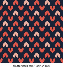 Large bold hearts in light pink and coral on a dark blue background. Perfect for Valentine’s Day 