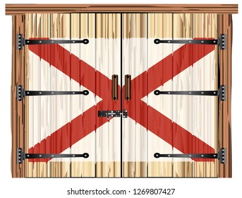 A large closed wooden barn double door with bolt and hinges and the Alabama flag painted on