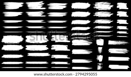  Large collection of white grunge brush strokes and paint marks isolated on black background,
 Distressed brush stroke set featuring dry paint textures and artistic grunge elements,
 Abstract paintbrush mark bundle with rough ink strokes and textured brush effects
