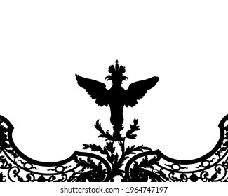 Large eagle on an ancient metal gate. Isolated silhouette on white background