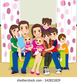 Large family of mother and father with seven children happy posing smiling together sitting on a sofa