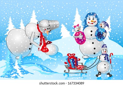 large family of snowmen in the winter nature background. snowing. Pope makes new snowman