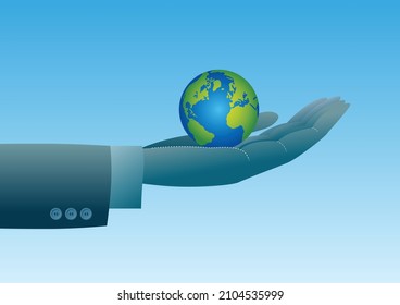 A large hand holds planet earth in it