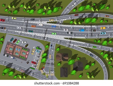 large high-speed interchange of the highway with a store and a crossroads top view