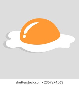A large orange fried egg is placed on top of the egg white