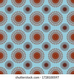 A large orange and small maroon mandala with repeating geometric lines