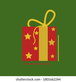 A large red gift wrapped with a gold ribbon with a bow on a green background