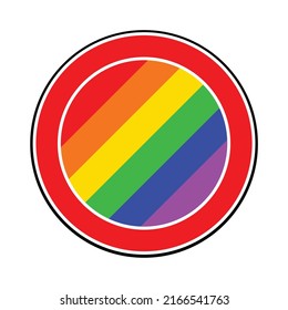 A large round red spoof traffic sign displaying the LGBT flag colors