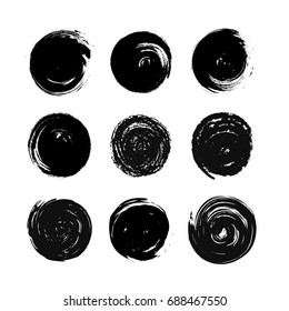 Large set of black grunge hand-drawn round spots isolated on white