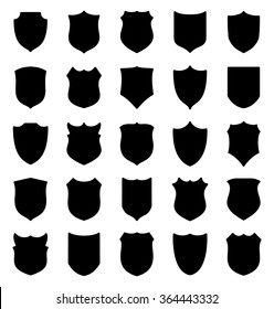 Large set of black shields silhouettes isolated on white background. Vector illustration.