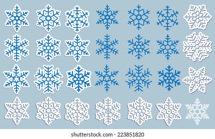 A large set of different silhouettes, paper and carved snowflakes with shadow