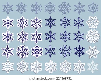 A large set of different silhouettes, paper and carved snowflakes with shadow