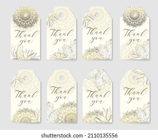 Large Set of golden flowers designed as a form for tags Thank you. Golden outline of tropical flowers and mandala on a light background.