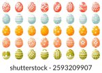 A large set of painted Easter eggs of different colors on a white background. Decorated Easter eggs, with floral and geometric ornaments. Easter egg hunt, an attribute of the holiday.