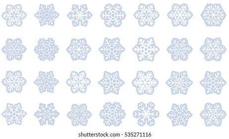  large set of various carved, lace or simple light blue  paper snowflakes on white background