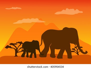 Large and small elephant walk across the savannah in the evening