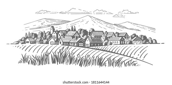 large village with fields en mountains background