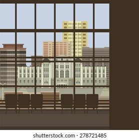 large windows Airport several chairs a nice view on the city buildings in the sky flying aircraft