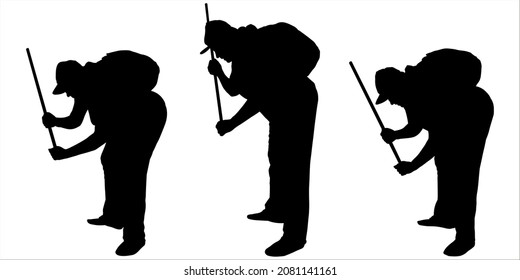 The large woman bent down towards the ground. She holds a stick in his hands. Tries to see something below. Black female silhouette on a white background in a cap with a bag on her back. Side view.