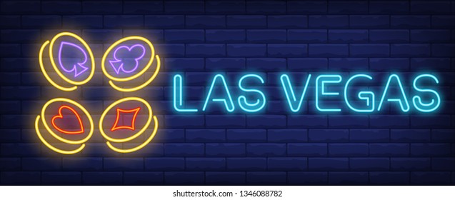 Las Vegas neon text with playing card suit symbols on gold coins. Gambling and poker club design. Night bright neon sign, colorful billboard, light banner. Vector illustration in neon style.