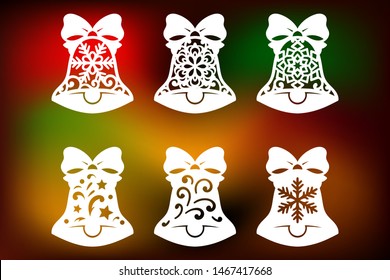Laser cut christmas bell set with pattern of snowflakes and swirls. Xmas decorations cutting templates collection, vector.