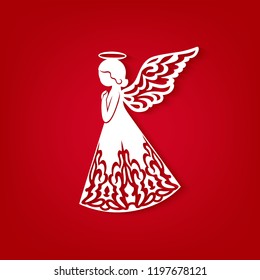 Laser cut paper Christmas angel on a red background. Greeting Card for wood carving, paper cutting and Easter decorations. Beautiful applique on red background. Abstract Isolated vector objects.